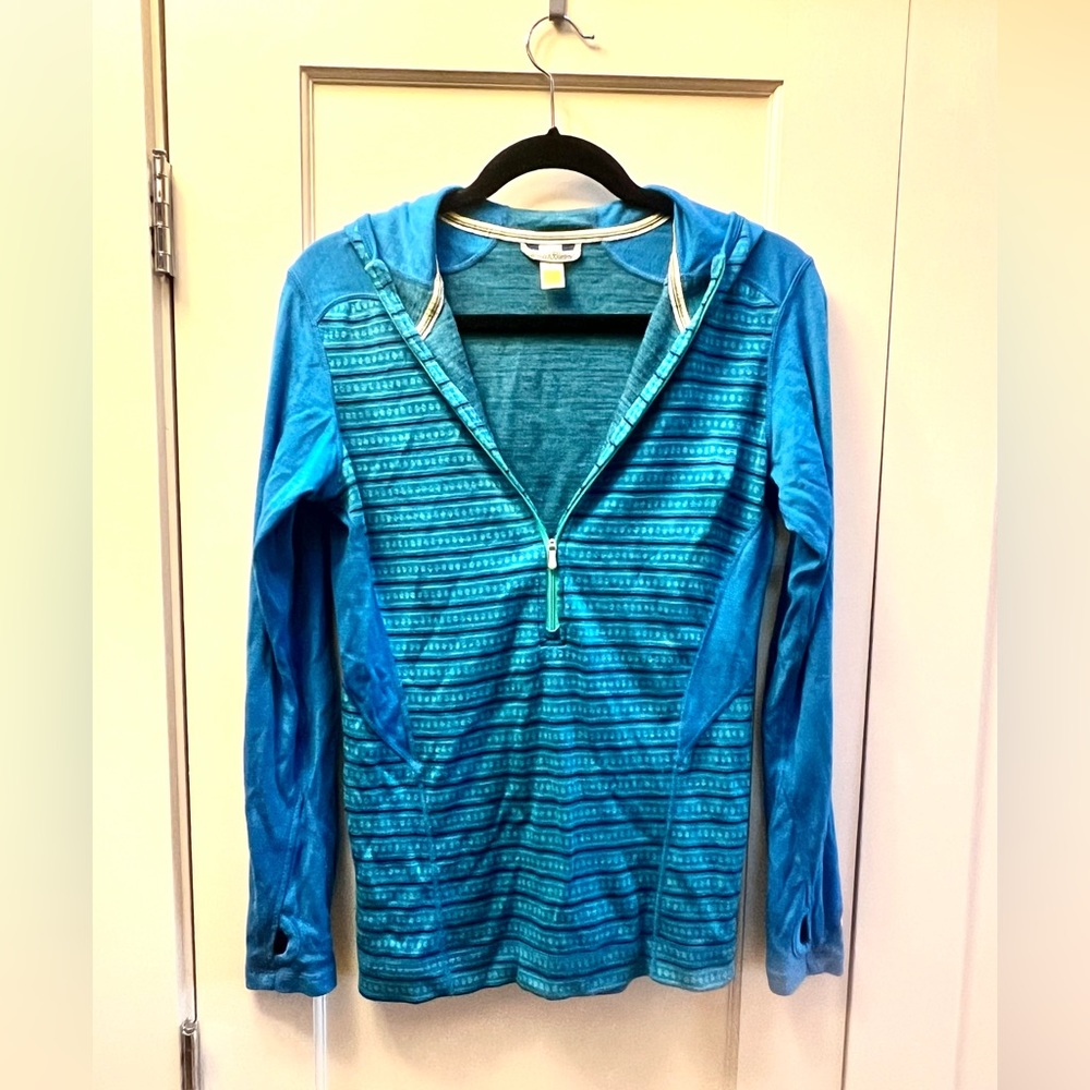 Mid-weight half-zip merino wool base layer with scuba hood.